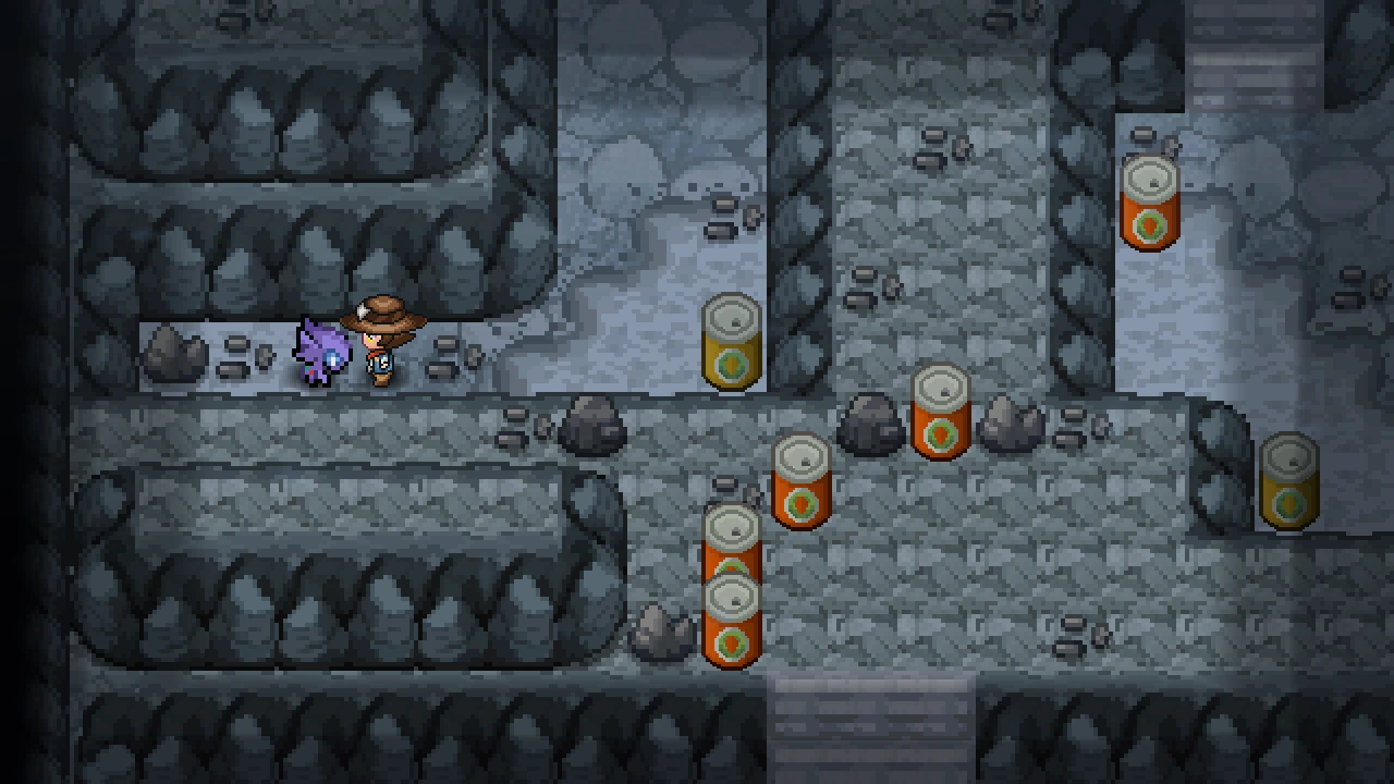 A Sableye standing on the left side of the Iron Island B1F R cave room, with the player walking up to it.